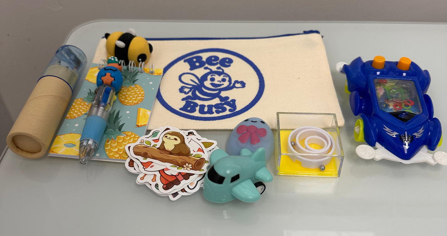 Bee Busy Bags including bag,writing pad, fun pen, colored pencil pack, stickers plus at least 4 sensory toys - plus a Bee fidget toy. Available in girls, boys and gender neutral collections. Age 2-6