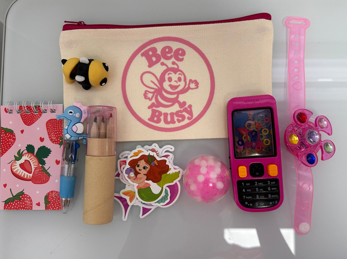 Bee Busy Bags including bag,writing pad, fun pen, colored pencil pack, stickers plus at least 4 sensory toys - plus a Bee fidget toy. Available in girls, boys and gender neutral collections. Age 2-6