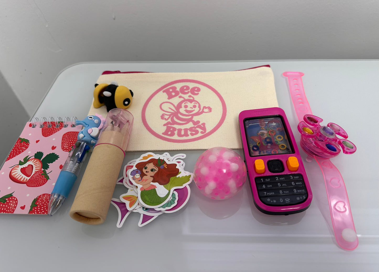 Bee Busy Bags including bag,writing pad, fun pen, colored pencil pack, stickers plus at least 4 sensory toys - plus a Bee fidget toy. Available in girls, boys and gender neutral collections. Age 2-6